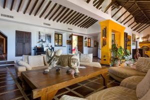 a living room with a cow statue on a coffee table at Cortijo Boutique Marbella in Marbella