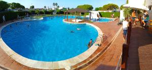 a large swimming pool with people in it at Camping San Javier in San Javier
