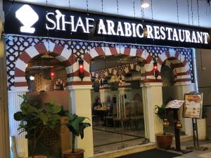a sharmaarma restaurant with a sign on the front of it at Vista Alam Studio Units - Pool, food court in Shah Alam