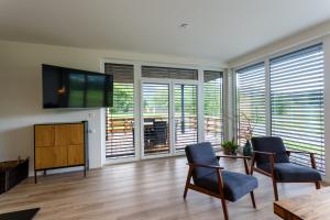 TV a/nebo společenská místnost v ubytování Apartmán na golfu