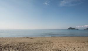 a sandy beach with the ocean in the background at GARDELLI RESORT in Laganas