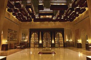 a large lobby with a fountain in the middle of it at Suryagarh Jaisalmer in Jaisalmer