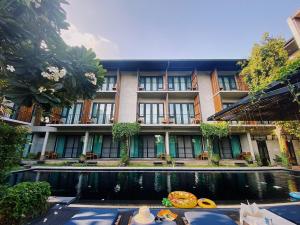 a large building with a view of a city at Lamphu House Chiang Mai - SHA Extra Plus Certified in Chiang Mai