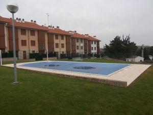 a swimming pool in front of a building at Los Nietos in Briones