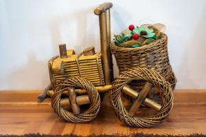 two wicker baskets sitting on top of a wooden floor at Zlatiborski Konaci in Zlatibor