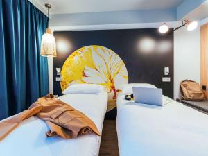 Postel nebo postele na pokoji v ubytování ibis Styles Le Treport Mers Les Bains