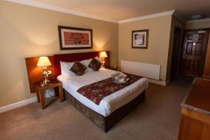 Letto o letti in una camera di Hamlet Court Hotel