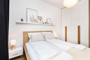 Postel nebo postele na pokoji v ubytování Apartamenty Garnizon Doskonała Lokalizacja Gdańsk by Noclegi Renters
