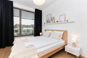 Postel nebo postele na pokoji v ubytování Apartamenty Garnizon Doskonała Lokalizacja Gdańsk by Noclegi Renters
