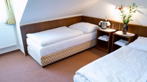 Posteľ alebo postele v izbe v ubytovaní Hotel Floret