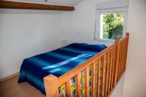 Postel nebo postele na pokoji v ubytování Gîte Les chênes