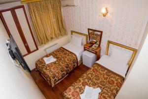 Postel nebo postele na pokoji v ubytování Meddusa Hotel