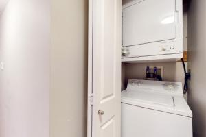 a laundry room with a washer and dryer at Glacier's Reach in Whistler