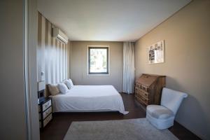 מיטה או מיטות בחדר ב-Quinta da Casa Nova