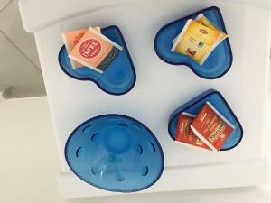 a refrigerator with blue plates and food in it at Casa Regina in Castelluzzo