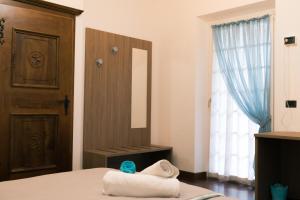 Postel nebo postele na pokoji v ubytování Al Chiar di Luna B&B Valtellina