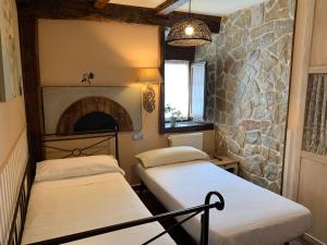 Cama o camas de una habitación en Akla La Casa Del Puente