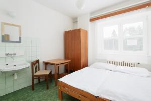 Łóżko lub łóżka w pokoju w obiekcie Hotel Medlov Depandance