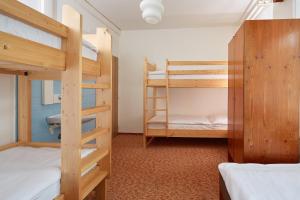 Łóżko lub łóżka w pokoju w obiekcie Hotel Medlov Depandance