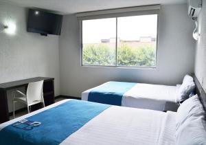 Letto o letti in una camera di Hotel Ros Gaud