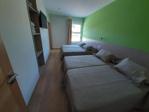 Postel nebo postele na pokoji v ubytování Hosteria de Gonzar