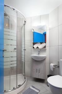 a bathroom with a shower and a sink at Studios Paradise in Kalamaki Heraklion