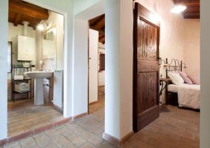 Postel nebo postele na pokoji v ubytování Agriturismo Il Poggio, Casa Rosa