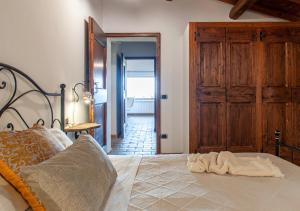 Postel nebo postele na pokoji v ubytování Agriturismo Il Poggio, Casa Rosa