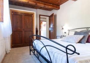 Postel nebo postele na pokoji v ubytování Agriturismo Il Poggio, Casa Rosa