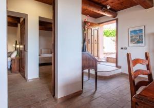 Postel nebo postele na pokoji v ubytování Agriturismo Il Poggio, Casa Rosa