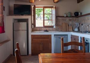 Kuchyň nebo kuchyňský kout v ubytování Agriturismo Il Poggio, Casa Rosa