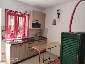 a kitchen with a table and a counter top at La Cantina di Giuliano in Falvaterra