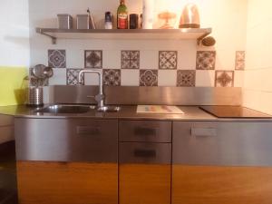 a kitchen with a sink and a counter at Maison Julien 3 in Menton +46 photos