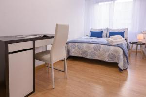A bed or beds in a room at Apartamento Centro Santiago