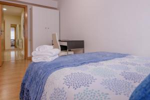 A bed or beds in a room at Apartamento Centro Santiago