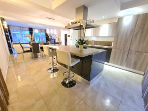 a kitchen with a table and chairs in a room at Villa Nemo in Poreč