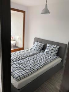 Postel nebo postele na pokoji v ubytování Apartament Ptasia