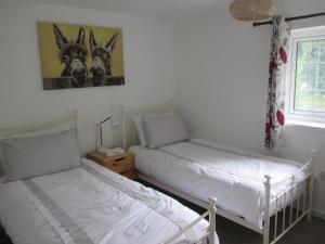 Llit o llits en una habitació de Hops Main House, Brockenhurst, New Forest