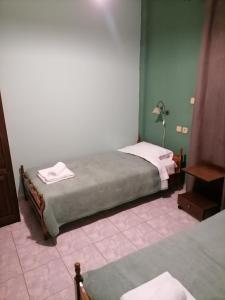 Säng eller sängar i ett rum på Guesthouse Chotos