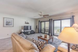 a living room with a couch and a table at 403 The Shores Condo in St. Pete Beach