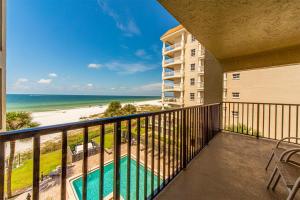 a balcony with a view of the beach at 403 The Shores Condo in St. Pete Beach