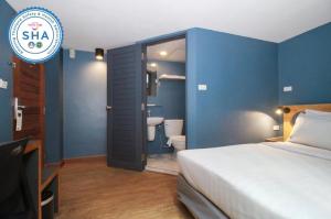 Postel nebo postele na pokoji v ubytování MyBed Ratchada