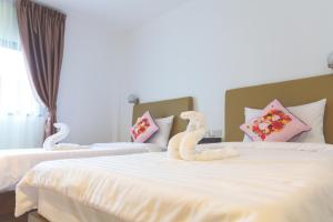 Ένα ή περισσότερα κρεβάτια σε δωμάτιο στο B.S Boutique Hotel +36 φωτογραφίες