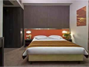 Postel nebo postele na pokoji v ubytování Hotel Des Roses