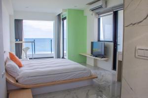 Postel nebo postele na pokoji v ubytování BEACH FRONT VILLA