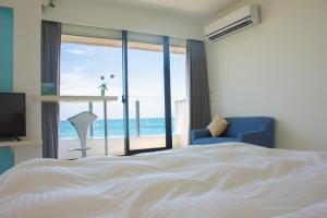 Postel nebo postele na pokoji v ubytování BEACH FRONT VILLA