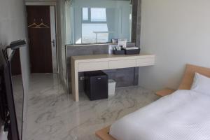 Postel nebo postele na pokoji v ubytování BEACH FRONT VILLA