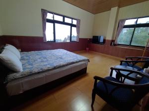 Postel nebo postele na pokoji v ubytování Lanting Yazhu B&B