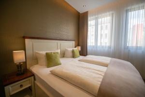 Ένα ή περισσότερα κρεβάτια σε δωμάτιο στο Apartment Central Leipzig