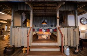 a large wooden house with a table in it at Hotel Apartment Central Leipzig-City & Zoo in Leipzig